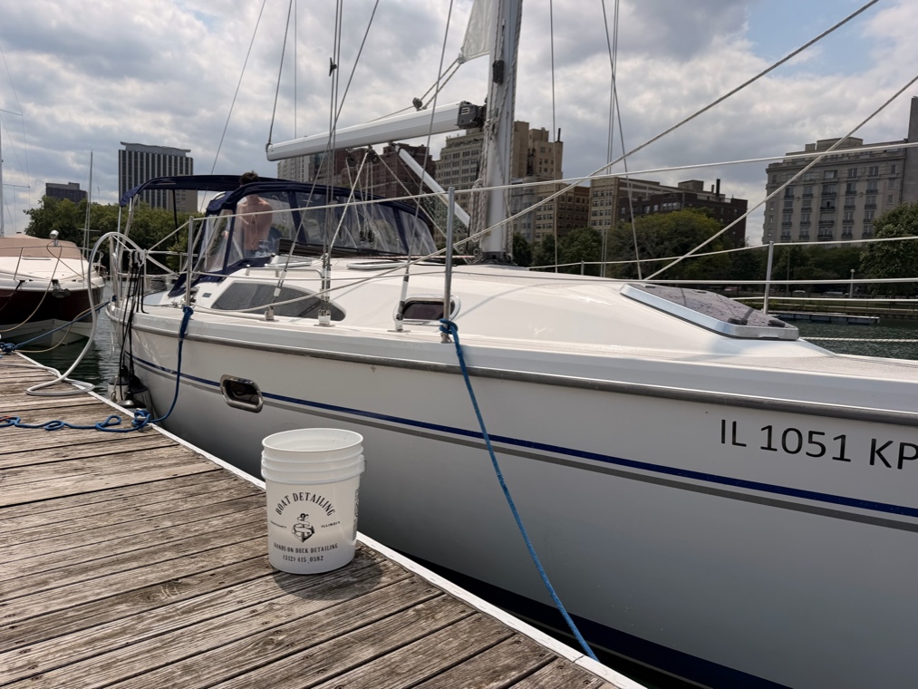 Boarding a boat with cleaning gear to start a detail
