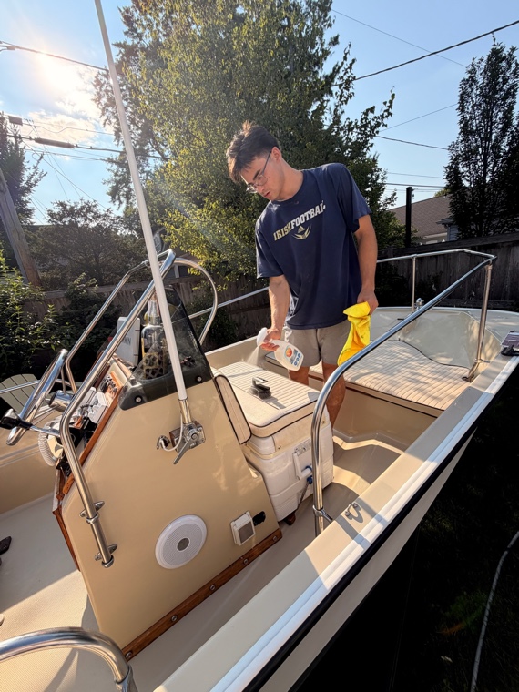 Hand-washing a boat's topsides during a detail